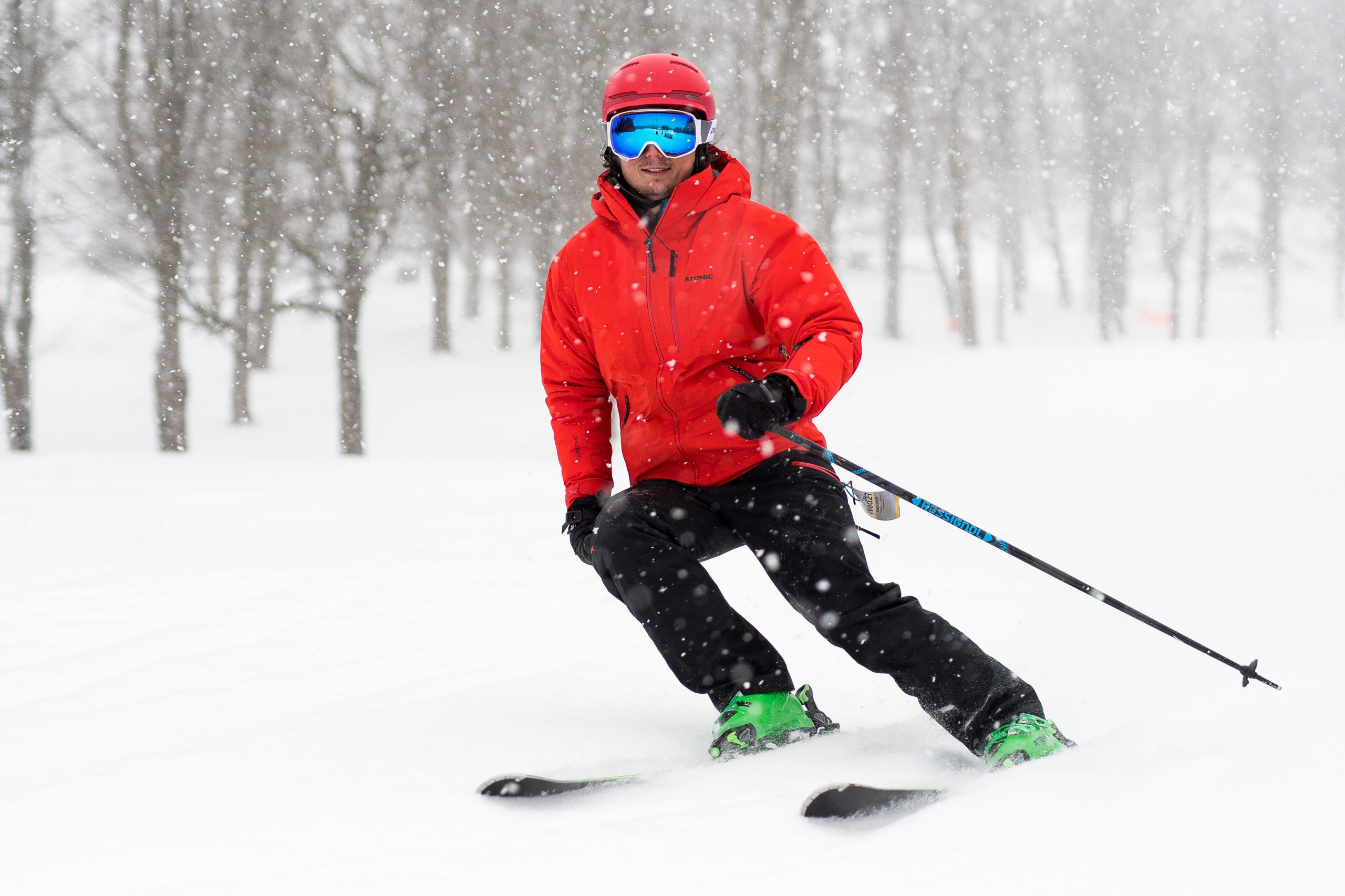 Man with a red jacket skiing