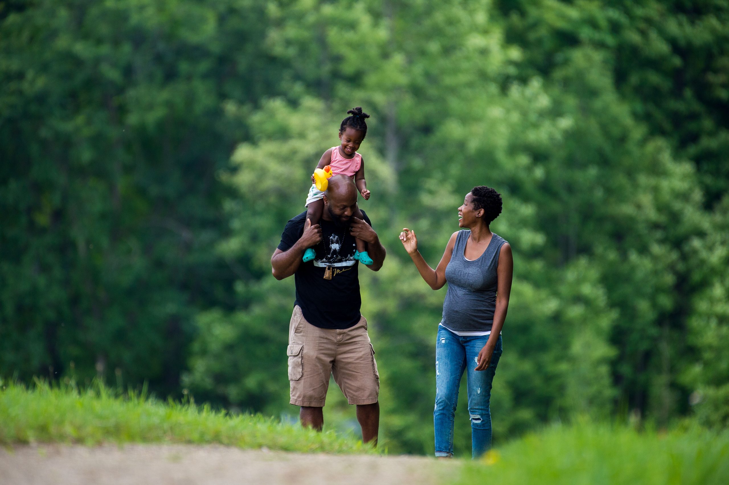 young family walking in the park