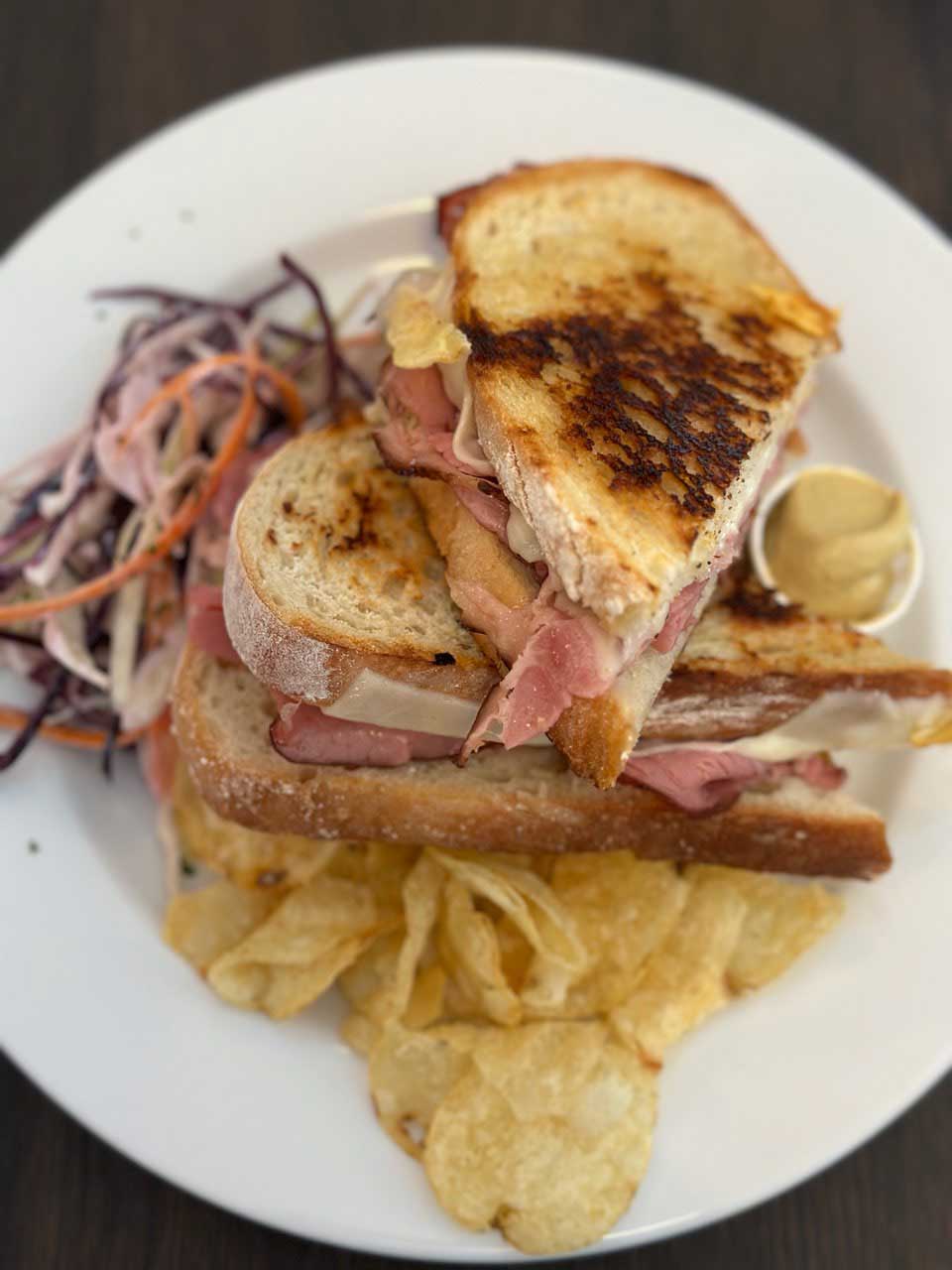 Delicious looking sandwich with salad and chips