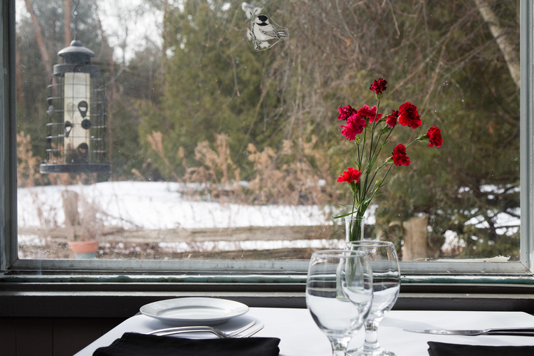 dining table of Black Birch Restaurant looking out the window to scenic views