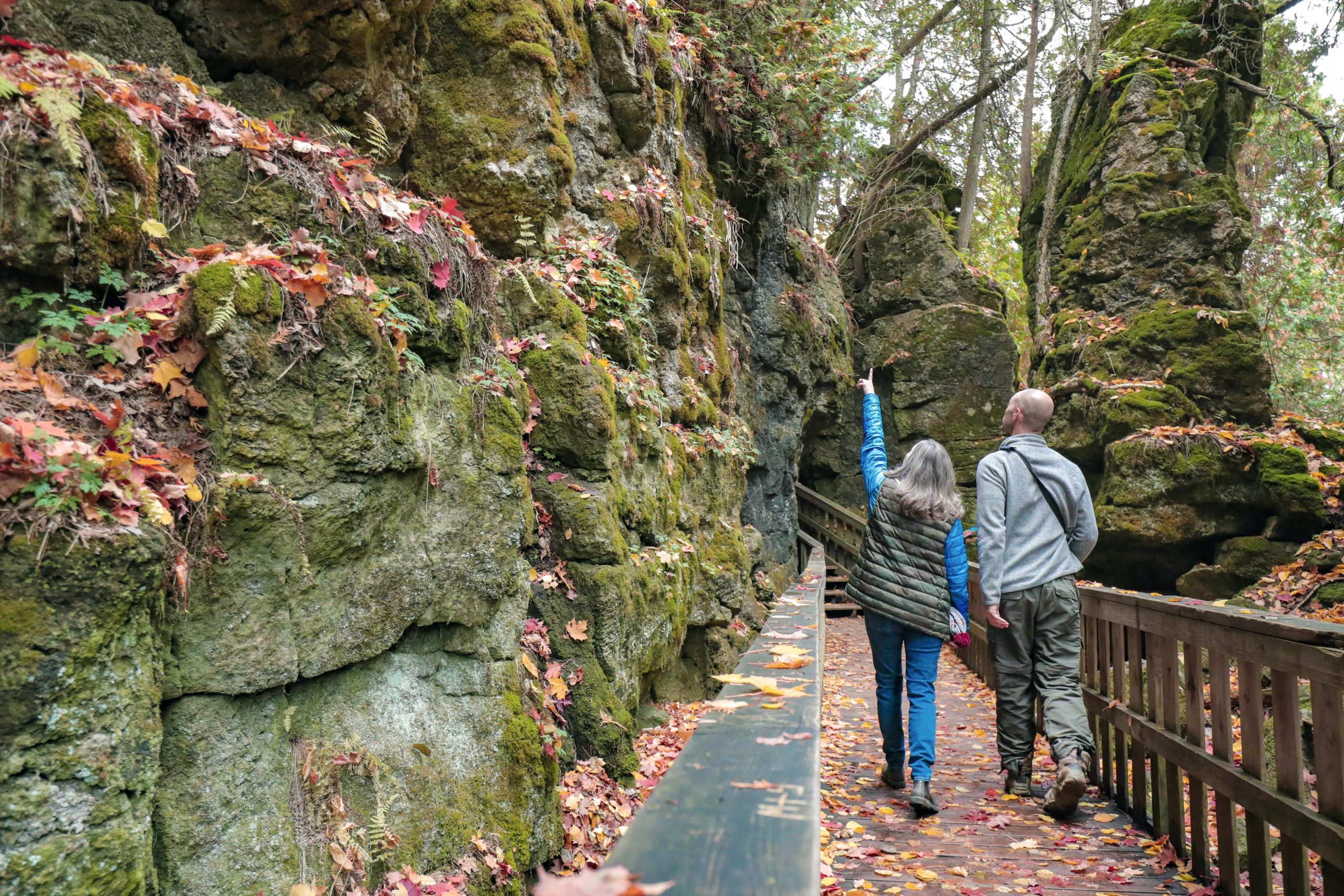 couple walking through canyons